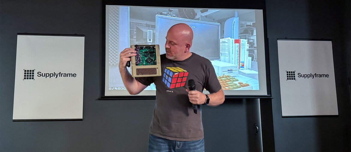 Mega IIe Supercon Links James (Bald Engineer) at Supercon 2023 on stage presenting Mega IIe